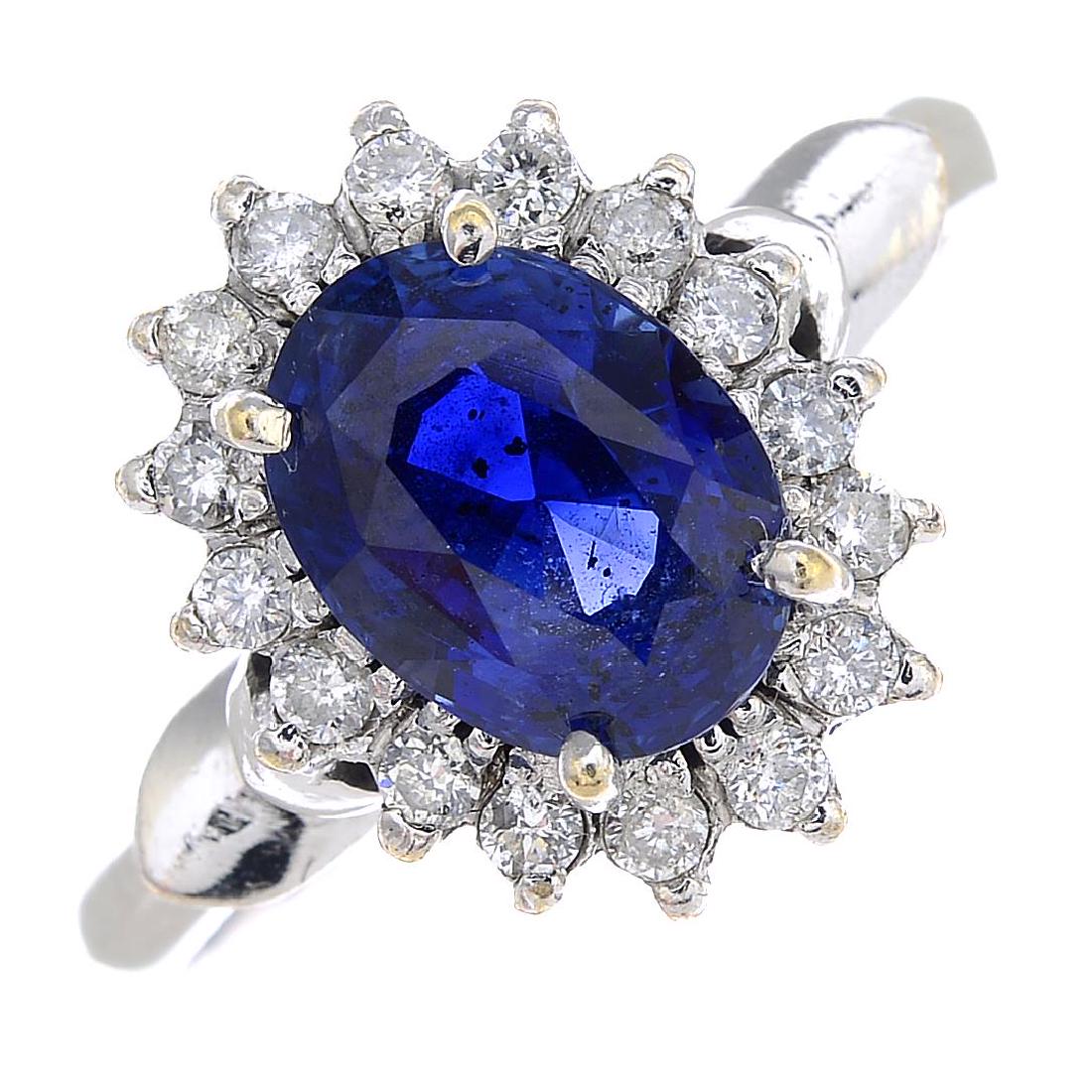 A sapphire and diamond cluster ring. The oval-shape (1 of 3)
