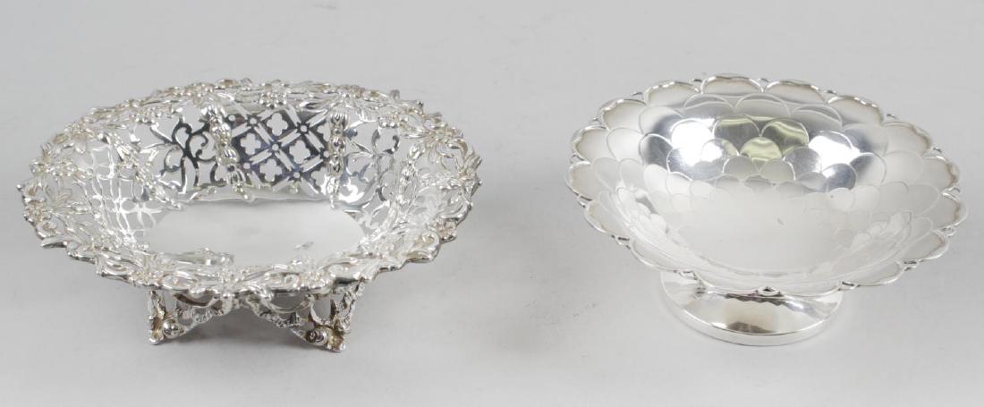 A Victorian silver bonbon dish, of oval form with: A Victorian silver bonbon dish, of oval form with foliate pierced sides and floral rim, raised upon four pierced feet, hallmarked Charles Stuart Harris, London 1893, length 5 1/2 inches (14cm). Togeth