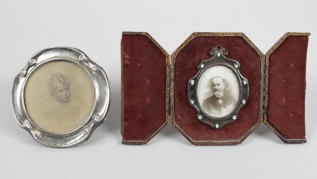 Two Edwardian silver mounted small photograph frames,: Two Edwardian silver mounted small photograph frames, the first of circular scrolled outline and easel back, hallmarked Deakin & Francis Ltd., Birmingham 1901, maximum diameter 4 3/4 inches (12 cm), t