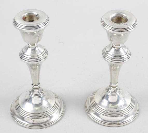 A pair of modern silver mounted candlesticks, each of Jun 03, 2019