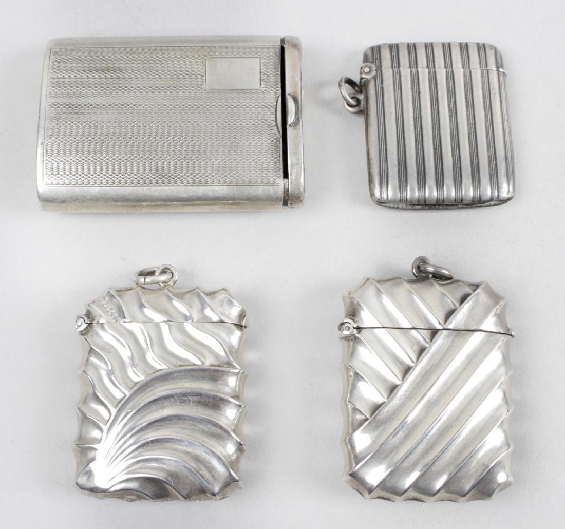 Two late Victorian silver vesta cases, each of oblong: Two late Victorian silver vesta cases, each of oblong form with similar diagonal and curved fluted decoration, hallmarked Birmingham 1892 and 1893. Together with a silver case, possibly for matches, t