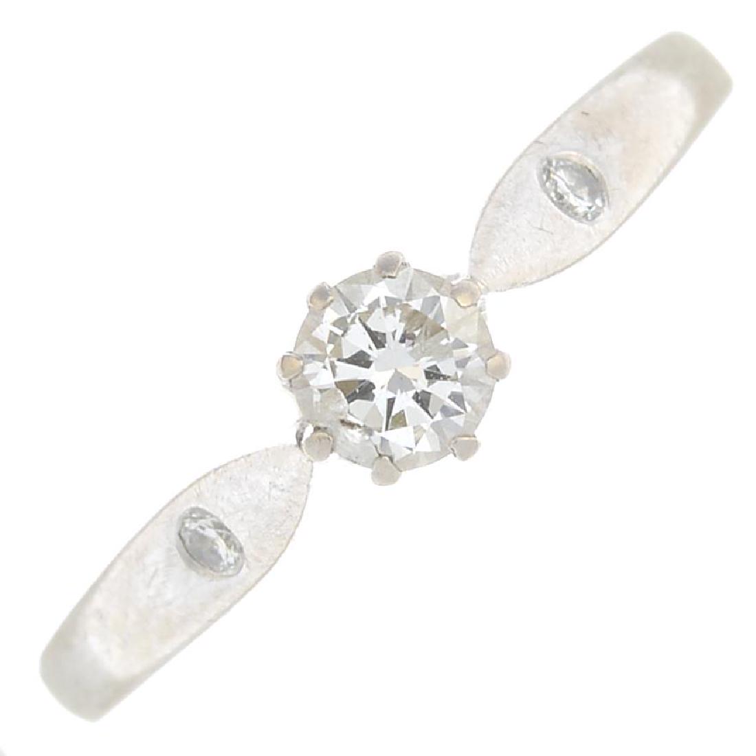 An 18ct gold diamond single-stone ring. The: An 18ct gold diamond single-stone ring. The brilliant-cut diamond, with similarly-cut diamond accent shoulders. Principal diamond estimated weight 0.30ct, I-J colour, P2 clarity. Hallmarks for Birming