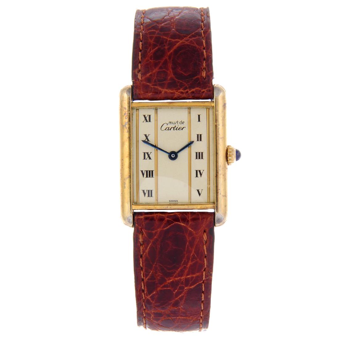 CARTIER - a Must De Cartier Tank wrist watch. Gold: CARTIER - a Must De Cartier Tank wrist watch. Gold plated silver case. Numbered 32856 590005. Signed quartz calibre 690. Cream dial with Roman numeral hour markers. Fitted to a signed brown crocodile 