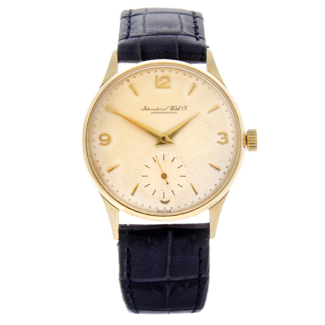 IWC - a gentleman's wrist watch. Yellow metal case,: IWC - a gentleman's wrist watch. Yellow metal case, stamped 18k with poincon. Numbered 1449632. Signed manual wind calibre 88. Silvered dial with arrowhead hour markers, Arabic numeral three, nine and
