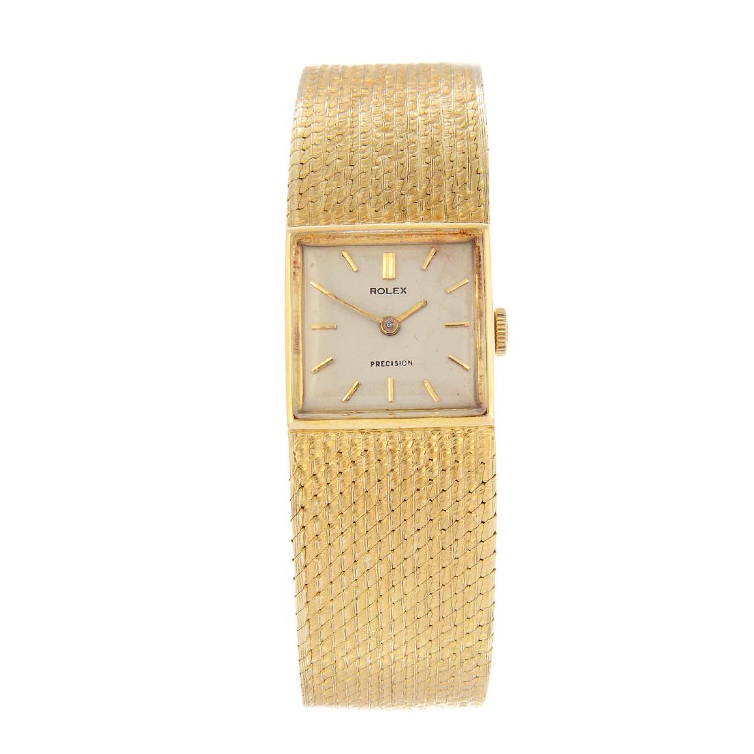 ROLEX - a lady's Precision bracelet watch. 18ct yellow: ROLEX - a lady's Precision bracelet watch. 18ct yellow gold case. Numbered 85-5876. Signed manual wind calibre 1400. Silvered dial with baton hour markers. Fitted to an integral 18ct yellow gold brace