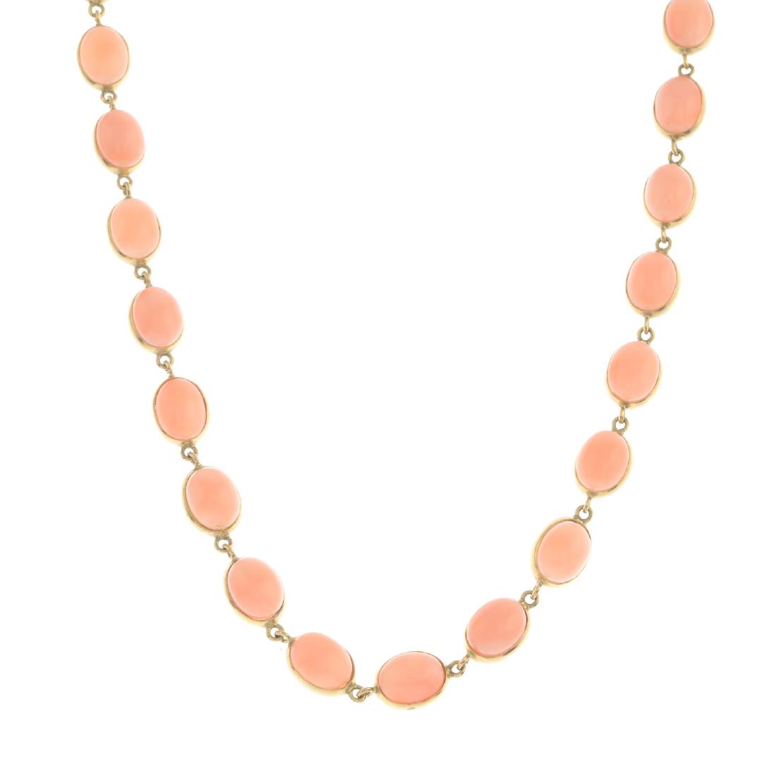CHIMENTO - an 18ct gold coral necklace. The oval coral: CHIMENTO - an 18ct gold coral necklace. The oval coral cabochon collets, with circular-link spacers, to the spring-ring clasp. Signed Chimento. Estimated dimensions of one coral cabochon 9.1 by 7.5 by