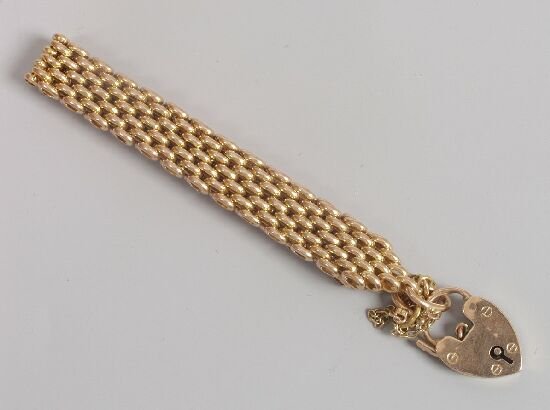 A gold four bar gate bracelet, tests 15