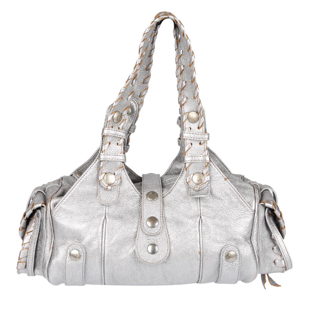 CHLOÉ - a Silverado handbag. Featuring a silver leather: CHLOÉ - a Silverado handbag. Featuring a silver leather exterior with whip stitched edge detail, open slip pockets to the front and back and patch pockets on either side, antiqued hardware, double fl