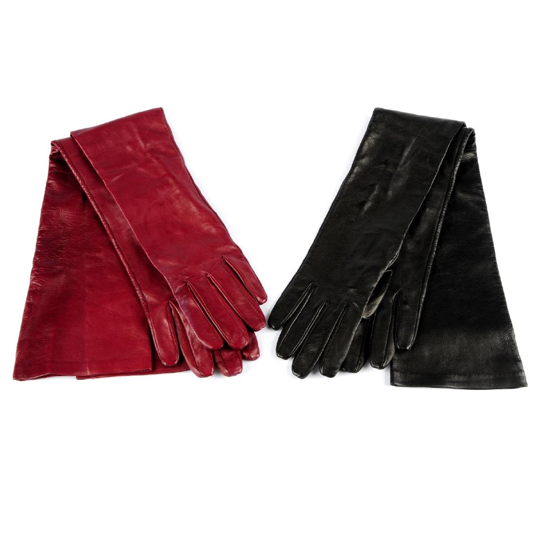 ESCADA - two pairs of full-length leather gloves. To: ESCADA - two pairs of full-length leather gloves. To include a black pair and a burgundy pair, silk lined with three buttons at each wrist. One pair labelled Escada, size 7.5.