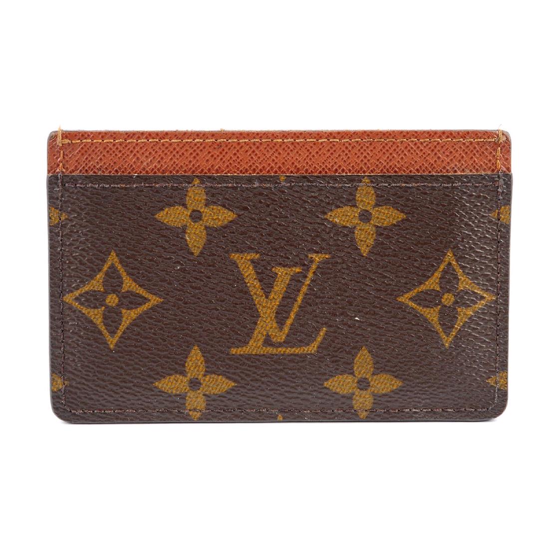 LOUIS VUITTON - a Monogram card holder. Featuring (1 of 3)