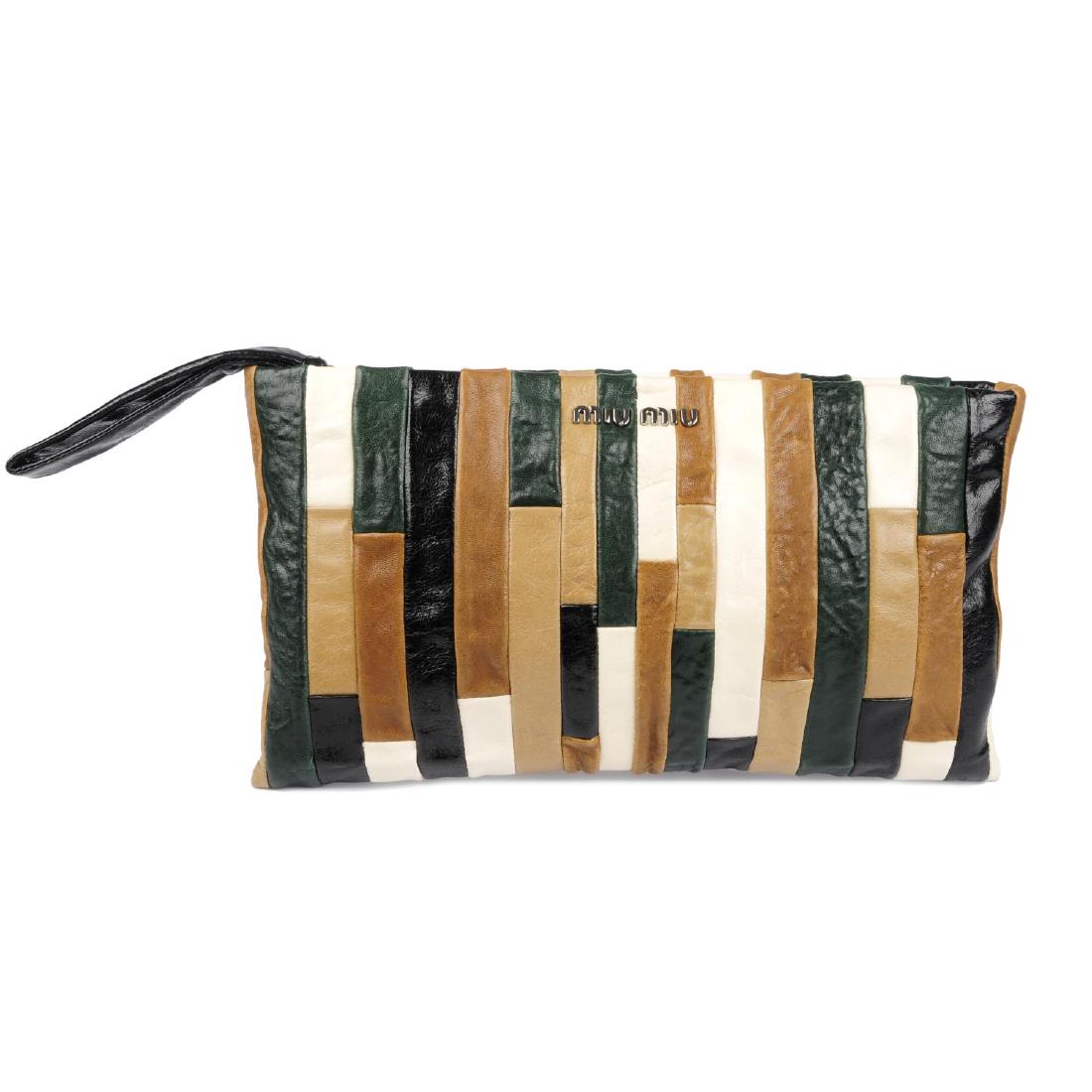 MIU MIU - a wristlet clutch. Crafted from multicoloured: MIU MIU - a wristlet clutch. Crafted from multicoloured patchwork lambskin leather, with maker's silver-tone front logo lettering, a black leather wristlet strap, top zip fastening and black satin lin