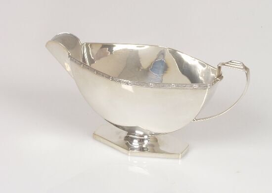 An Art Deco style sauce boat with appli