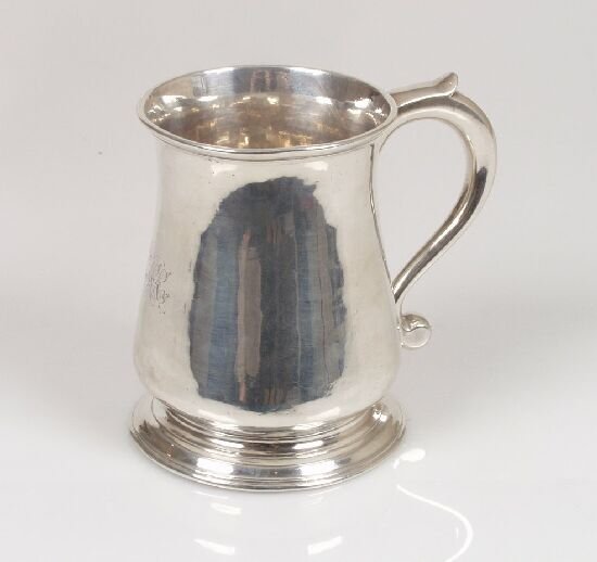 A George II mug of baluster form, on a