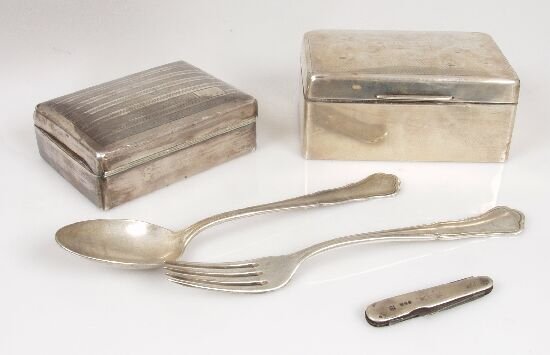 A silver cigarette case with engine tur