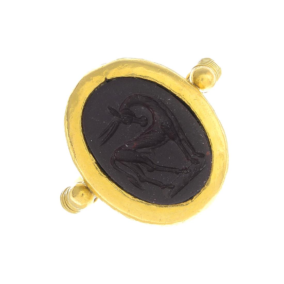 A carved hardstone intaglio ring.Stamped K22.Ring size: A carved hardstone intaglio ring.Stamped K22.Ring size N. 8.3gms.