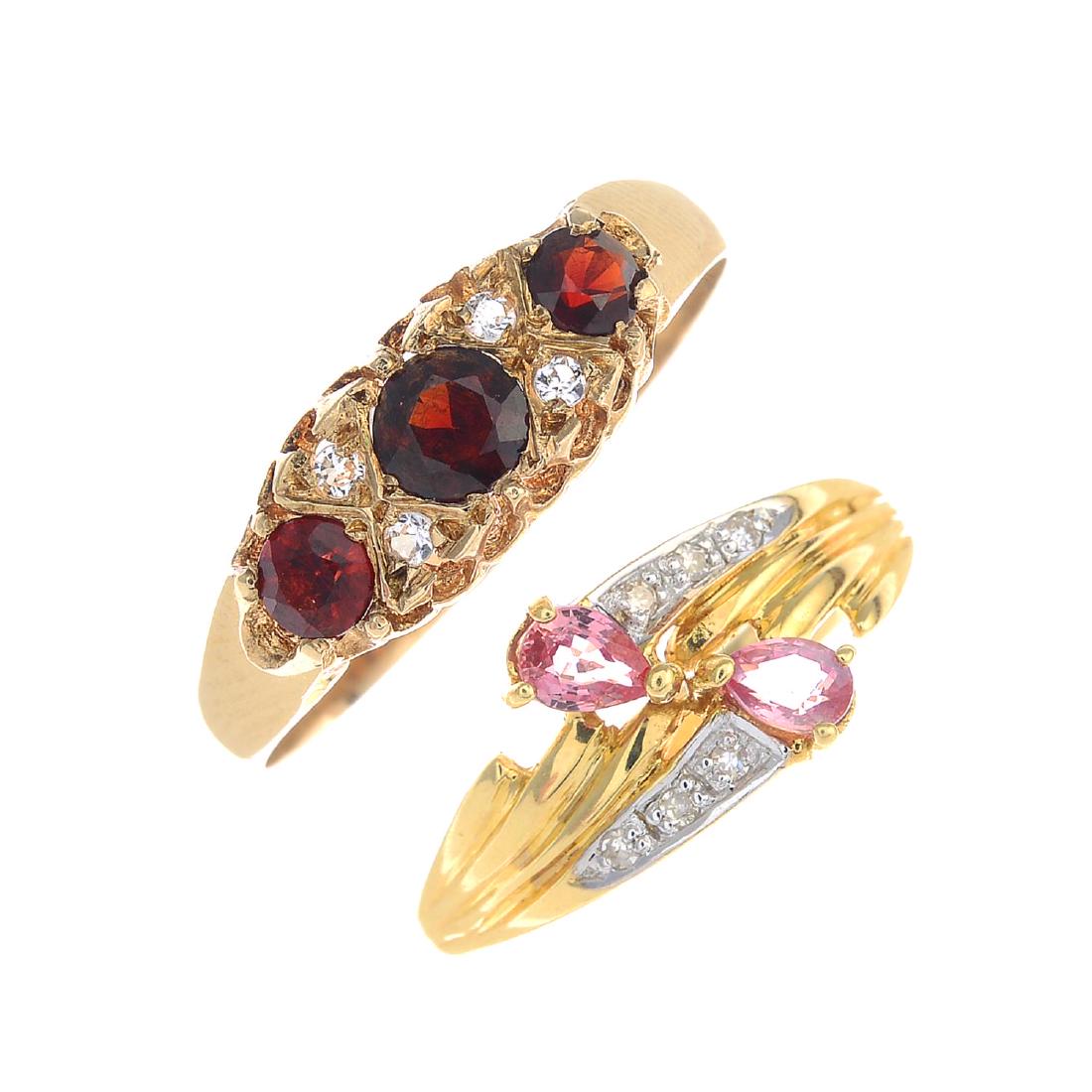 Four rings, variously set with diamonds, garnet (1 of 3)