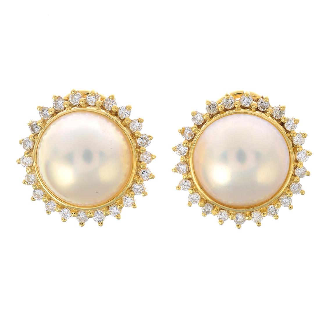 A pair of 18ct gold mabe pearl and diamond earrings. (1 of 2)