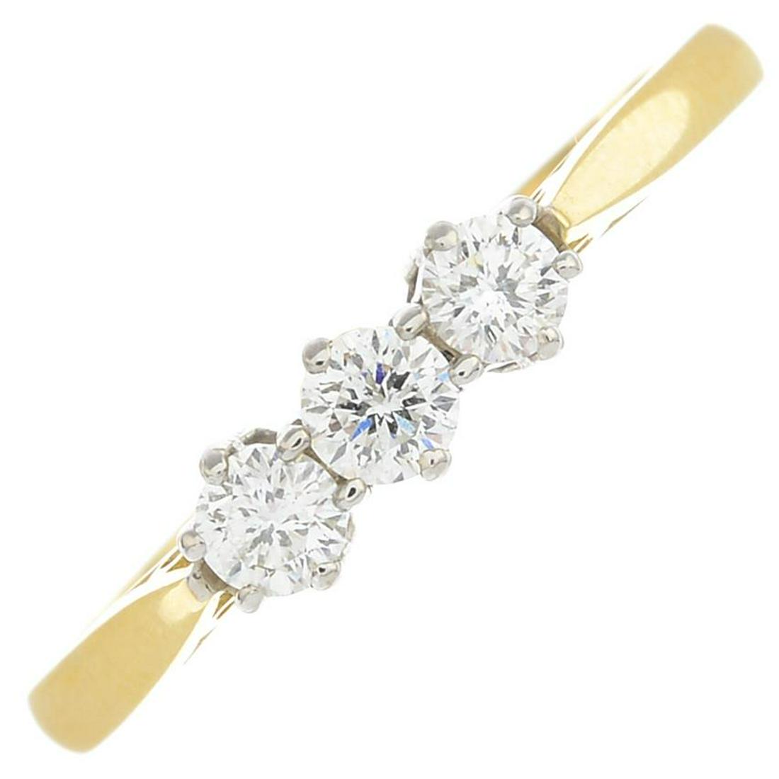 An 18ct gold diamond three-stone ring.Estimated total (1 of 3)