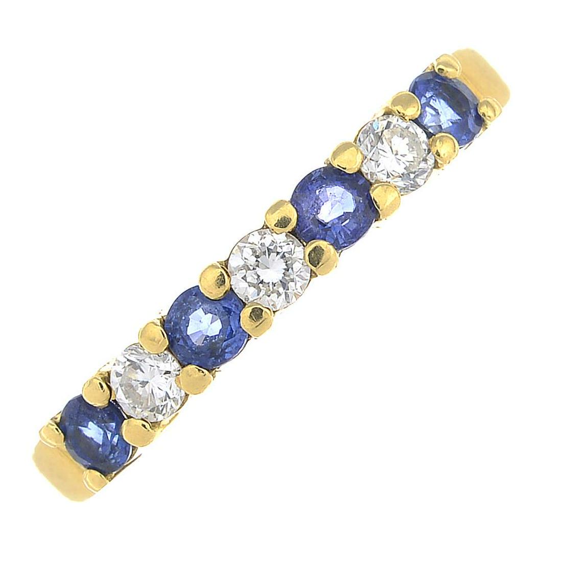 An 18ct gold diamond and sapphire seven-stone ring. (1 of 1)