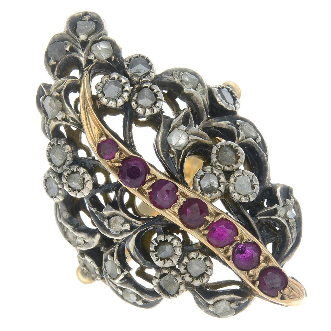 A ruby and diamond dress ring.Ring size U1/2. 8.8gms. (1 of 2)