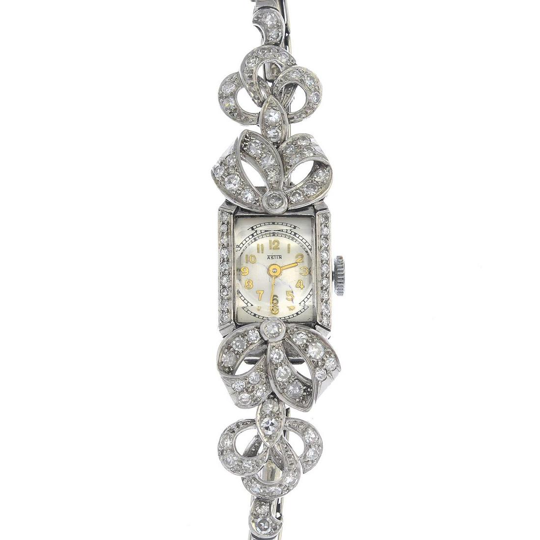 A lady's diamond cocktail watch. Estimated total (1 of 2)