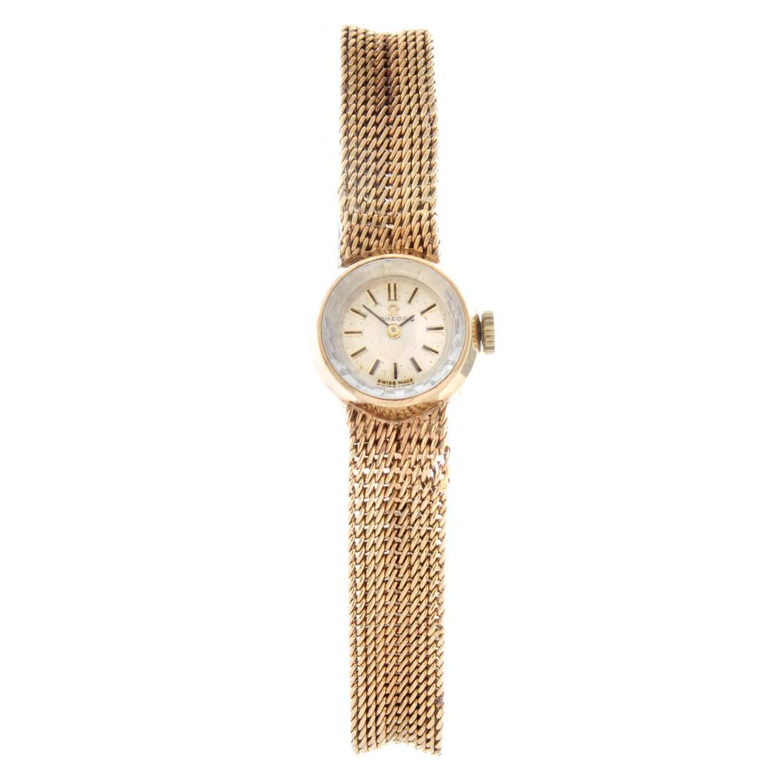 OMEGA - a lady's bracelet watch. 9ct yellow gold case, (1 of 4)