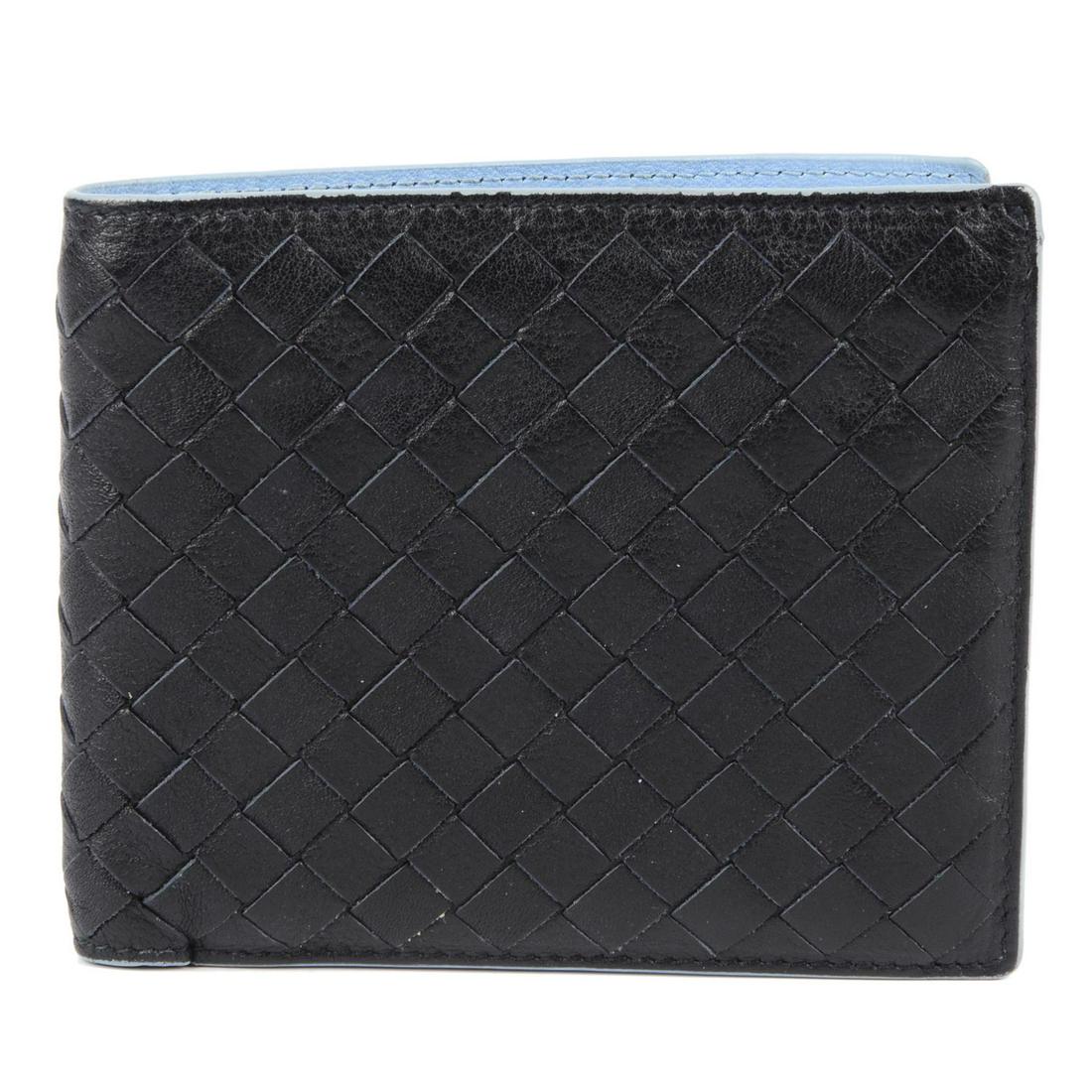 BOTTEGA VENETA - an Intrecciato leather bifold wallet.: BOTTEGA VENETA - an Intrecciato leather bifold wallet. Designed with maker's signature woven black leather exterior, opening to light blue leather lined interior, with a coin compartment, multiple car