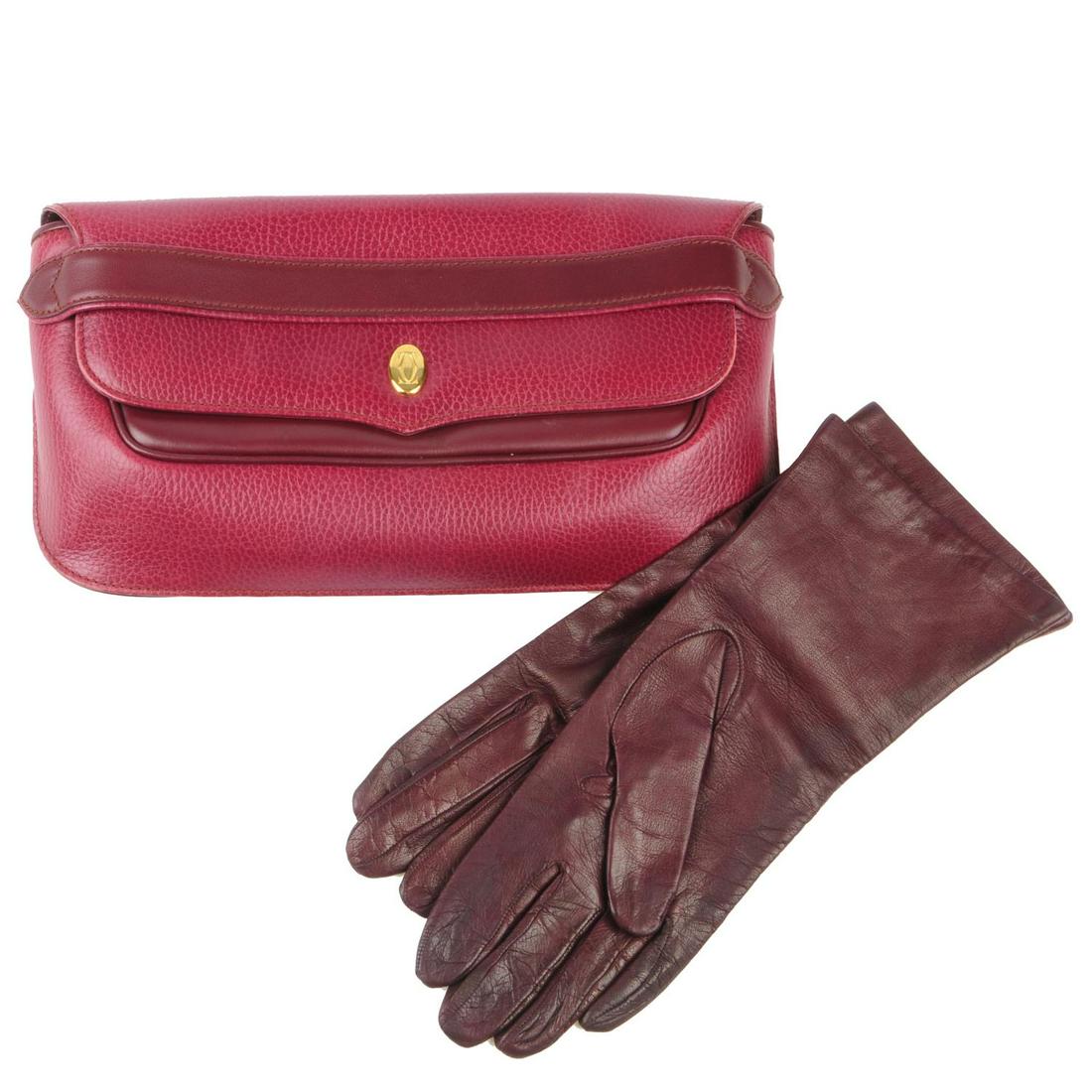CARTIER - a Bordeaux leather clutch and a pair of (1 of 7)