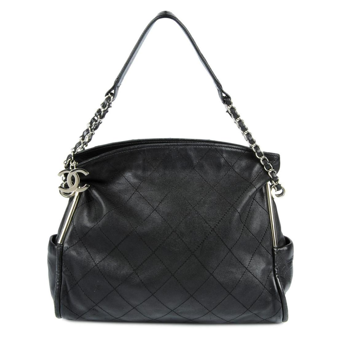 CHANEL - a black quilted leather handbag. With polished (1 of 4)