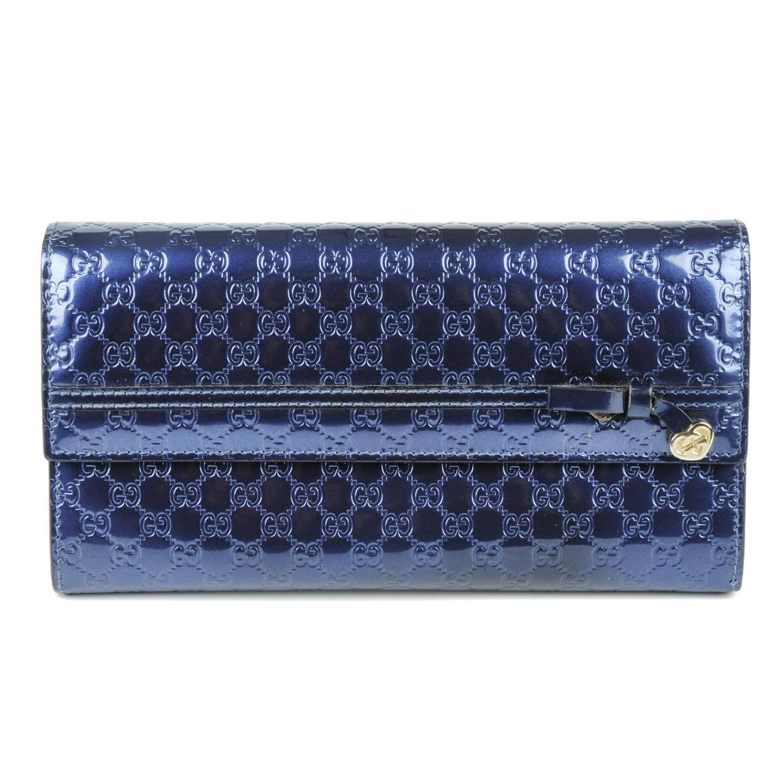 GUCCI - a blue patent Guccissima long wallet. Featuring (1 of 4)
