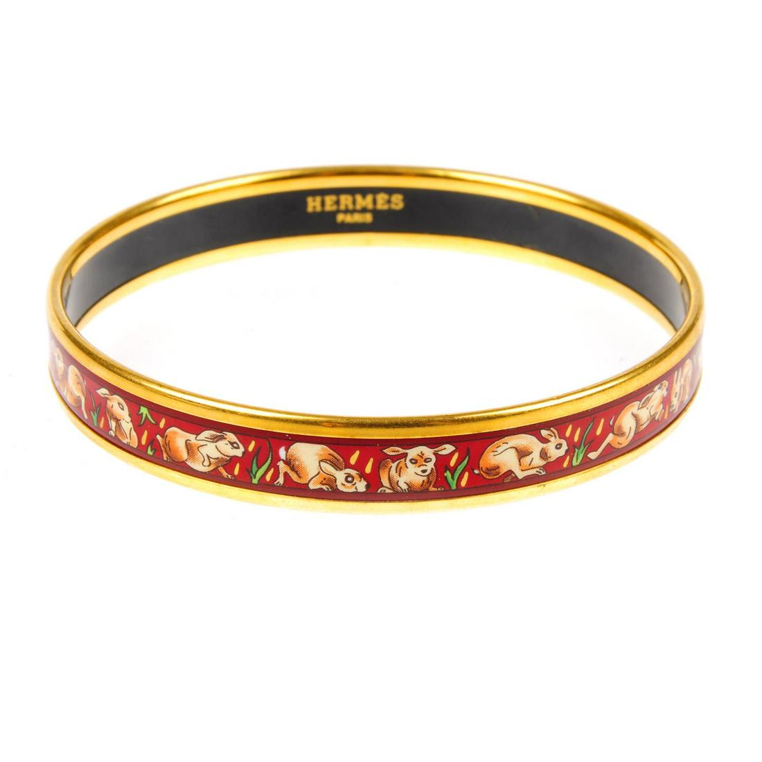 HERMÈS - an enamel rabbit bangle. Featuring a gold-tone (1 of 3)