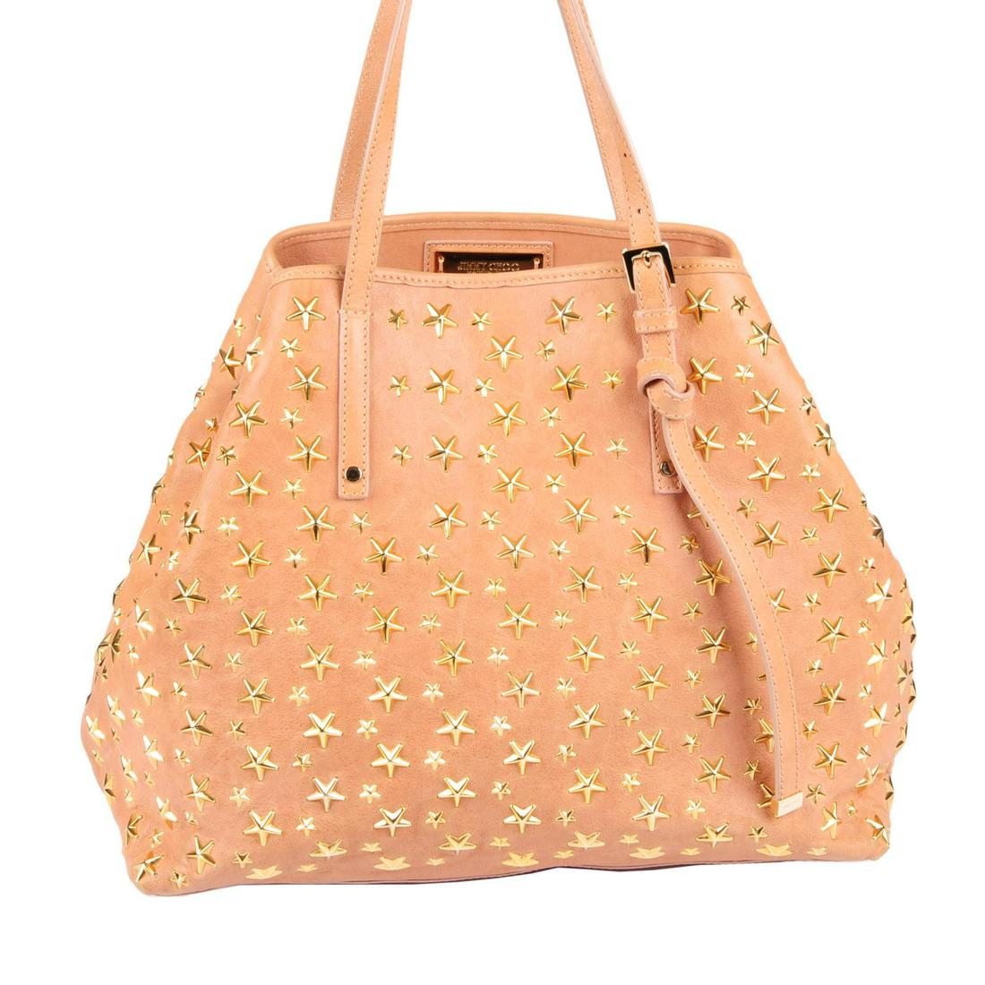 JIMMY CHOO - a Star Studded Sasha leather handbag.: JIMMY CHOO - a Star Studded Sasha leather handbag. Crafted from nude peach leather, featuring gold-tone metal stars studded throughout, with thin leather top handles, snap button fastening, one interi