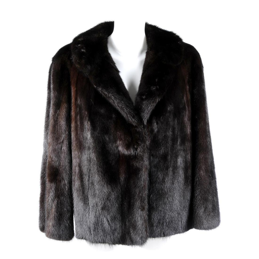 A dark ranch mink jacket. Featuring a notched lapel (1 of 3)