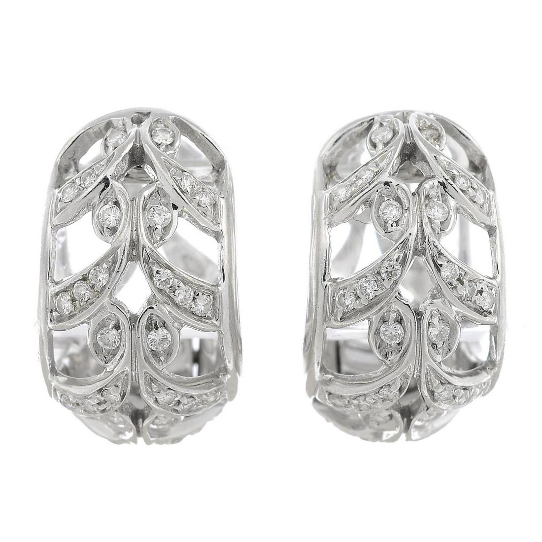 A pair of 18ct gold diamond foliate earrings, by: A pair of 18ct gold diamond foliate earrings, by Chimento.Signed Chimento.Estimated total diamond weight 0.60ct.Hallmarks for London.Length 2cms. 13.2gms.