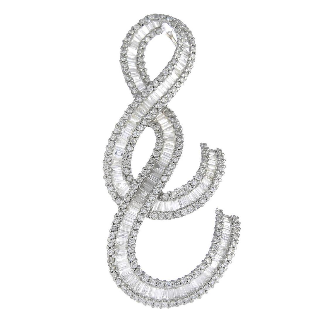 An 18ct gold diamond scrolling pendant, with concealed (1 of 2)