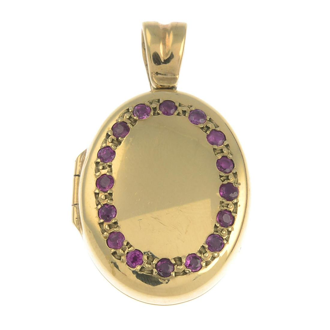 A 9ct gold ruby oval-shape locket.Hallmarks for (1 of 3)
