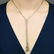A brilliant-cut Fancy Light Yellowish Brown diamond,