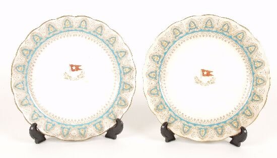 A pair of early 20th century bone china: A pair of early 20th century bone china plates, both of scalloped outline decorated with a blue and gilt border, the plain central reserves with a White Star shipping line crest, diameter 9" (23cm).