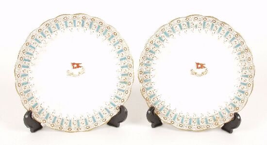 A pair of early 20th century bone china: A pair of early 20th century bone china plates, both of scalloped outline decorated with a blue and gilt border, the plain central reserves with a White Star shipping line crest, diameter 7.5" (19cm).