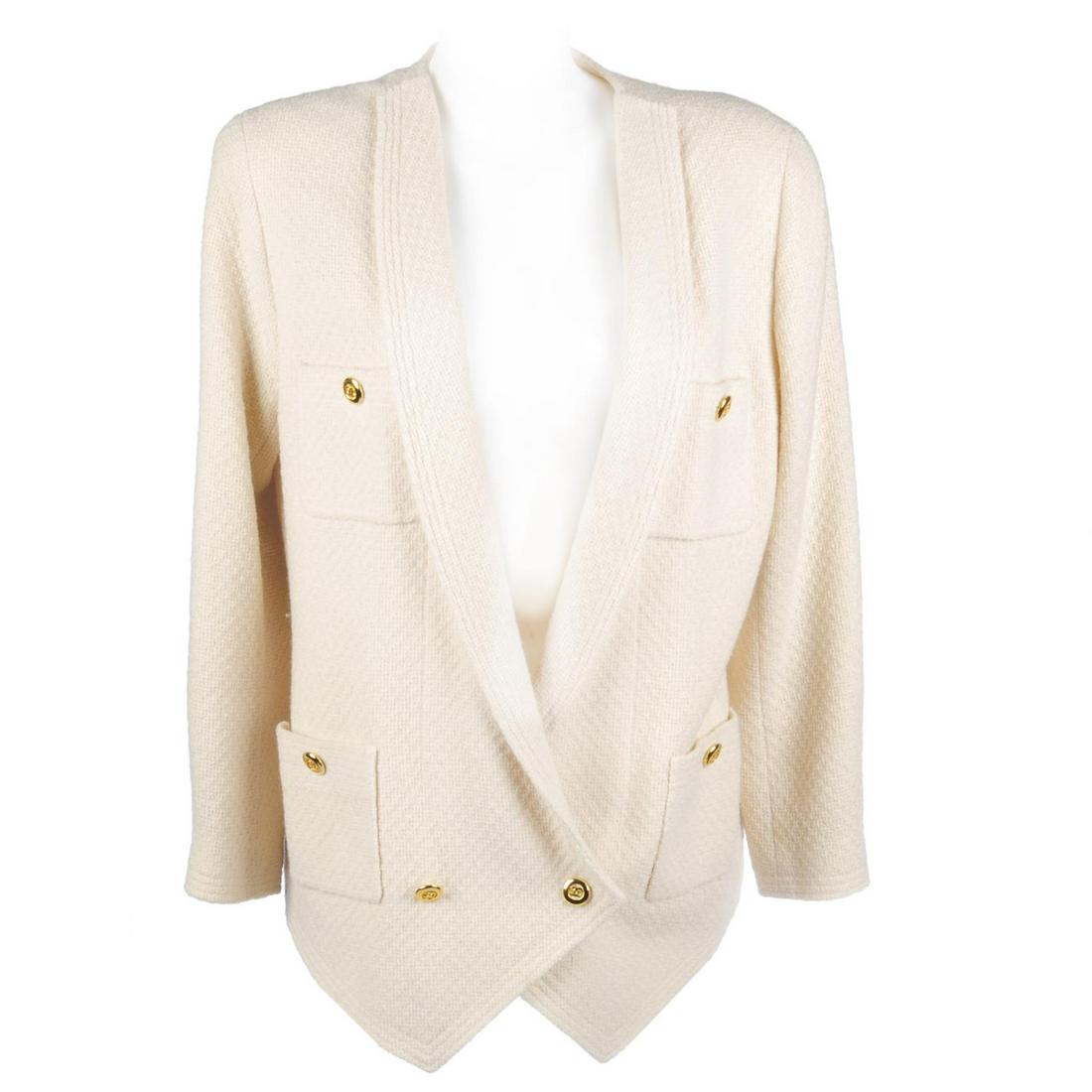 CHANEL - a cream wool tweed blazer. Featuring gold-tone: CHANEL - a cream wool tweed blazer. Featuring gold-tone CC button accents, four exterior patch pockets, CC logo fabric lining and a weighted chain to the hemline. Labelled Chanel Boutique, size 40.