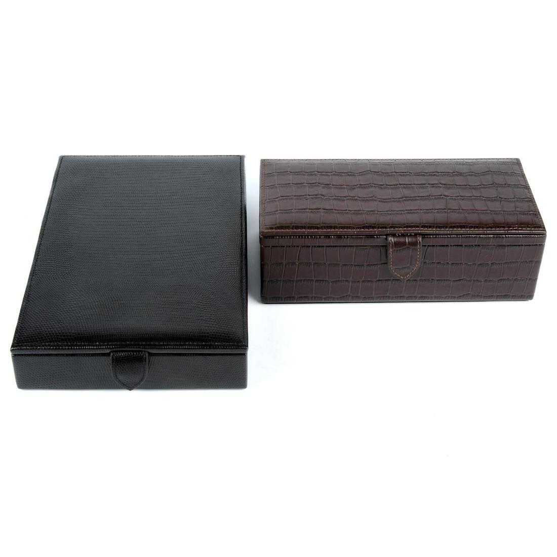 MAPPIN & WEBB - a leather jewellery case and watch: MAPPIN & WEBB - a leather jewellery case and watch case. The jewellery case, crafted from black lizard embossed leather, featuring a compartmentalised interior and purple microfibre lining, together w