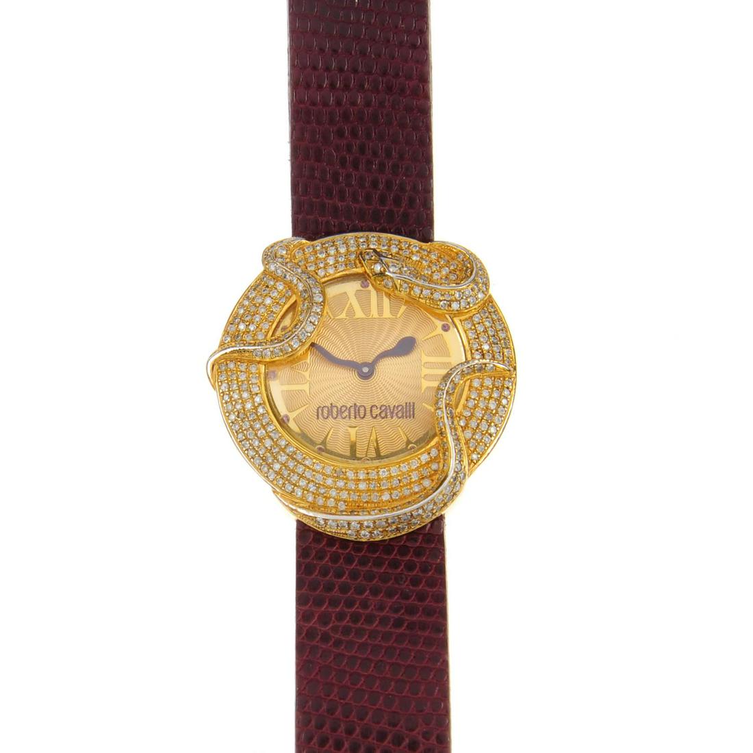 ROBERTO CAVALLI - a lady's gold plated diamond set: ROBERTO CAVALLI - a lady's gold plated diamond set wrist watch. Designed with a gold plated diamond set case with stainless steel case back, champagne dial with spearhead hour markers, quarterly Roman