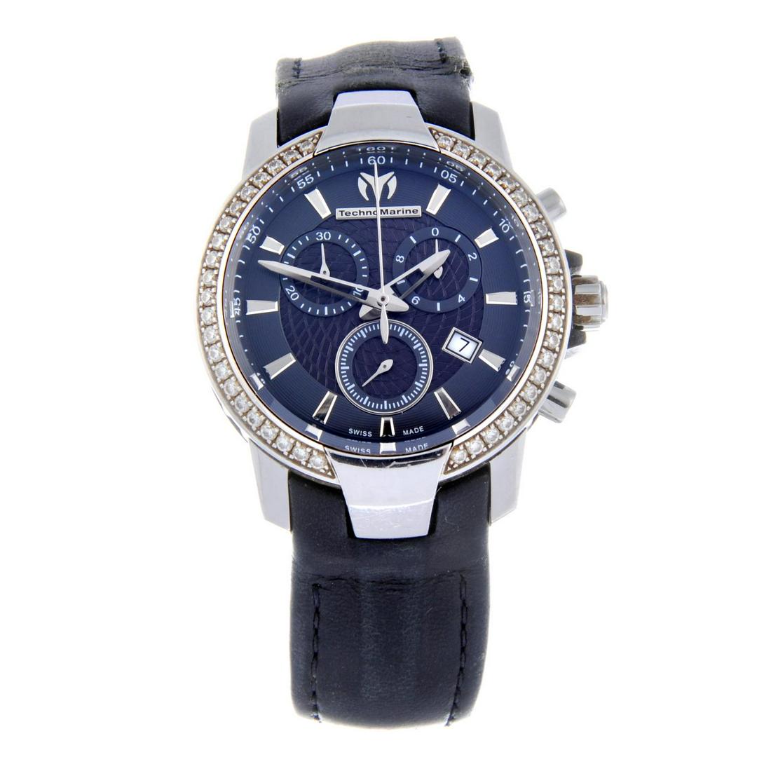 TECHNOMARINE - a chronograph wrist watch. Stainless: TECHNOMARINE - a chronograph wrist watch. Stainless steel case with factory white stone set bezel. Reference 609017, serial 10142978. Unsigned quartz movement. Dark grey dial. Fitted to a signed black