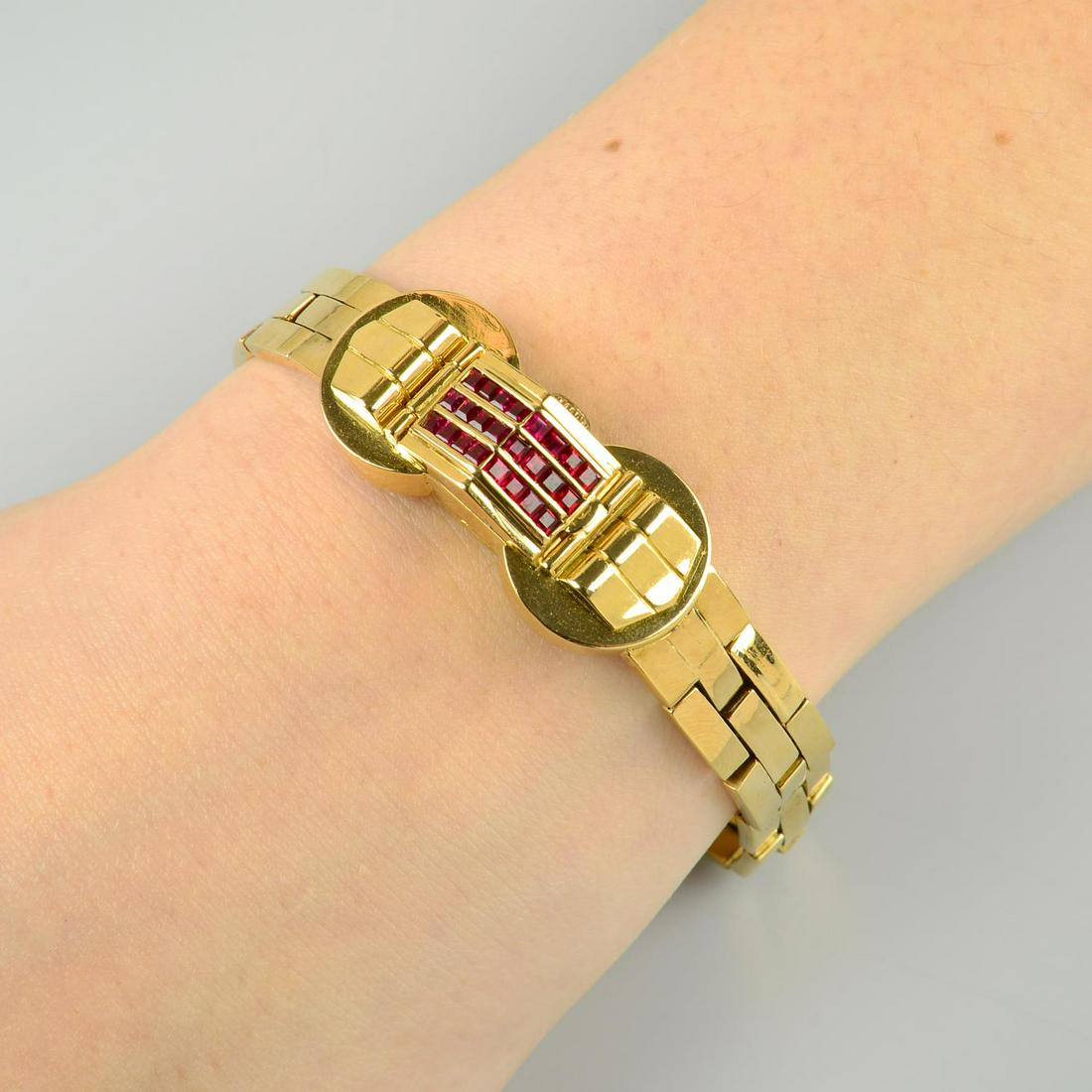 A 1940s 18ct gold ruby cocktail watch, by Eviana. (1 of 6)