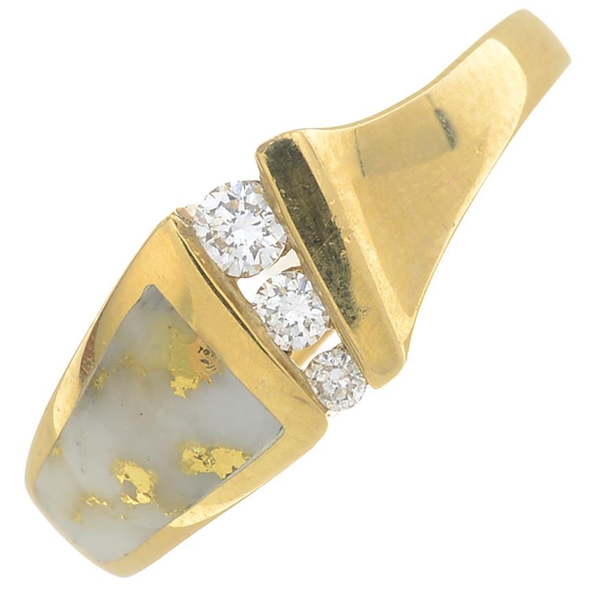An 18ct gold quartz and diamond dress ring.Estimated: An 18ct gold quartz and diamond dress ring.Estimated total diamond weight 0.15ct.Hallmarks for Sheffield, 2002.Ring size M1/2. 5gms.