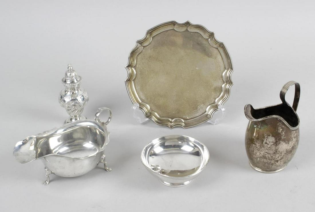 A group of assorted silver items, comprising a small: A group of assorted silver items, comprising a small modern salver with piecrust rim, hallmarked Roberts & Dore, Birmingham 1973, diameter 6 (15.5cm), a sauce boat of bellied form with scalloped rim,