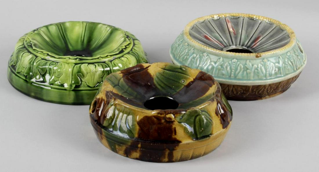 A collection of twenty Victorian pottery spittoons, to: A collection of twenty Victorian pottery spittoons, to include some examples with a Majolica style glaze, etc.