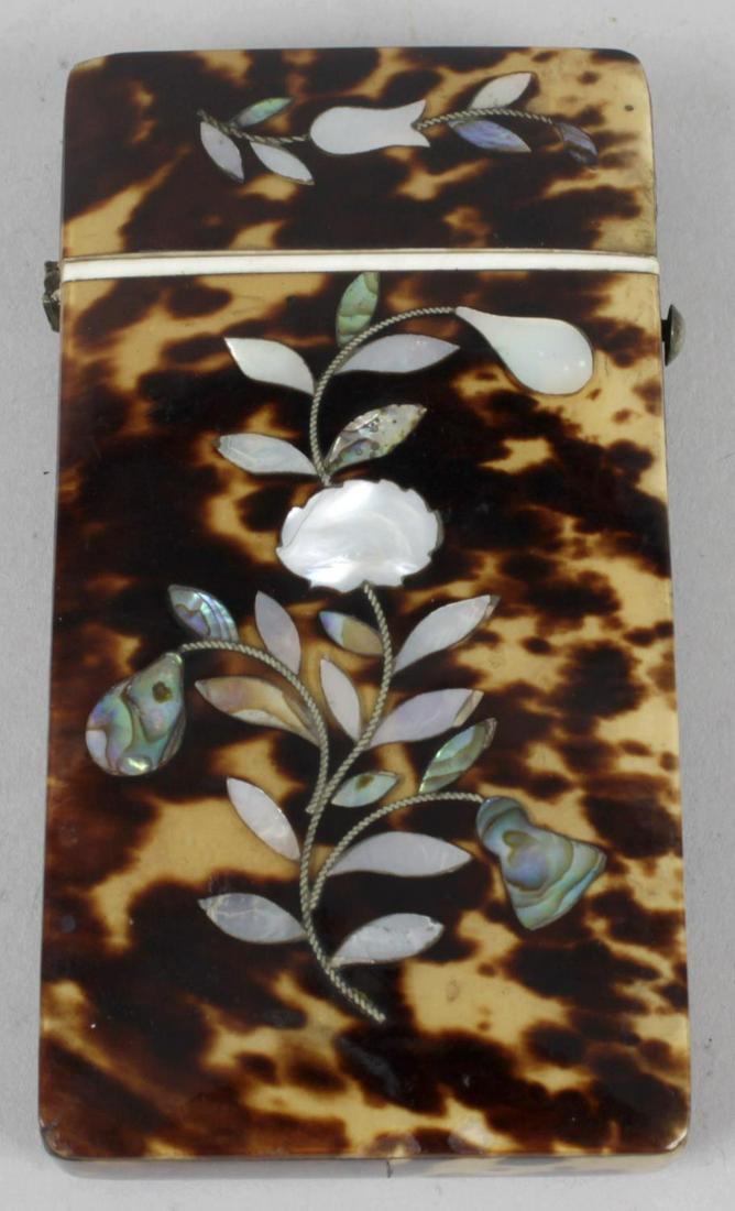 A 19th century tortoiseshell needle case of hinged: A 19th century tortoiseshell needle case of hinged rectangular form, the front and reverse panels with mother of pearl and abalone shell inlaid floral designs, 3.5 (9cm) high.