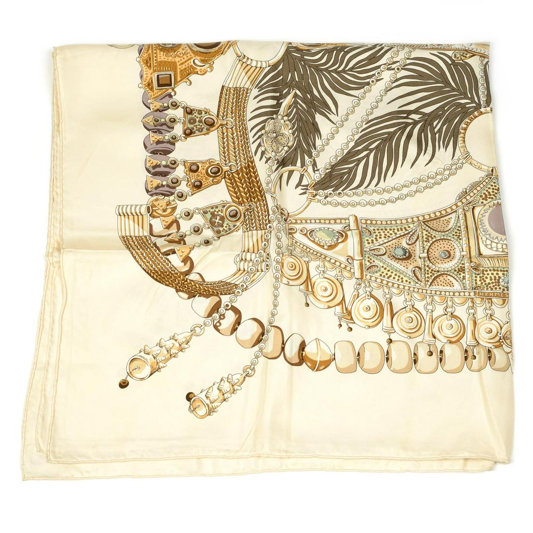 HERMÈS - a 'Terres Precieuses' silk scarf. Designed by: HERMÈS - a 'Terres Precieuses' silk scarf. Designed by Annie Faivre and features precious gems from different cultures in pastel and nude tones. Measures 89 by 90cms.
