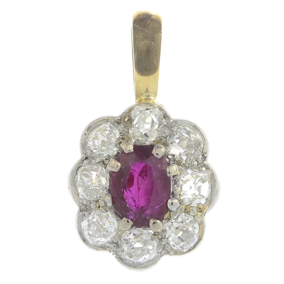 An old-cut diamond and ruby cluster pendant.Estimated (1 of 2)